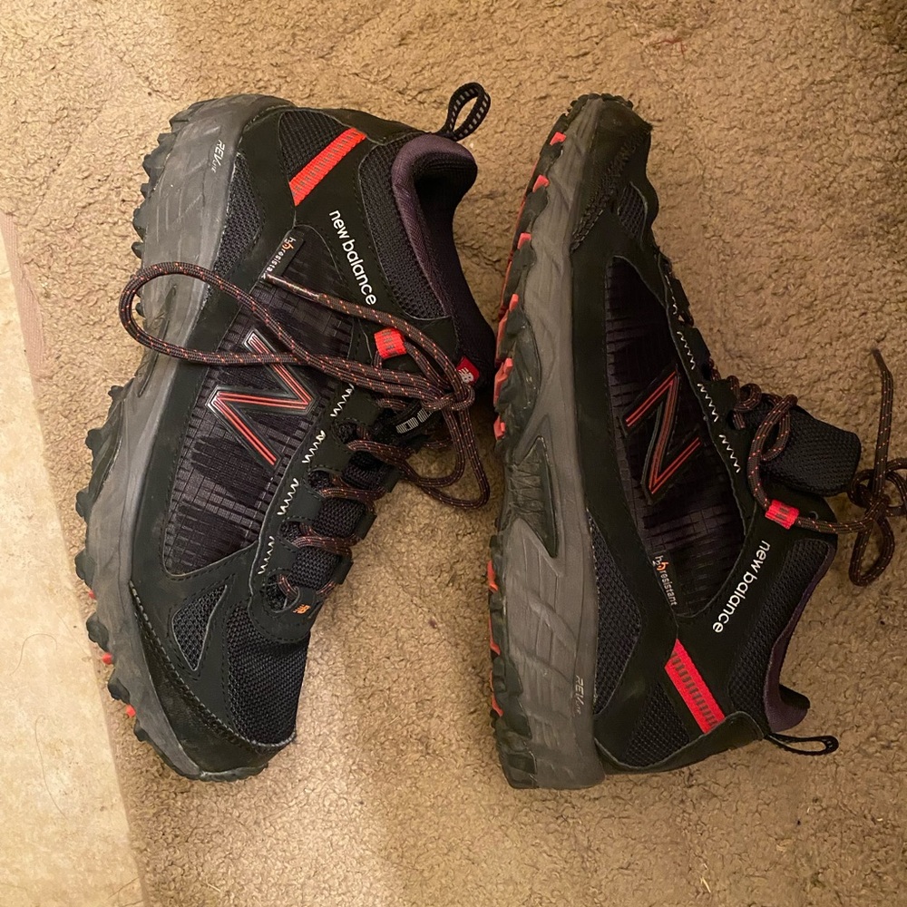 Black and red new balance hiking shoes size 8.